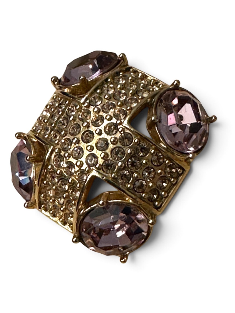 Monet gold-tone brooch with an abstract geometric design with purple stones
